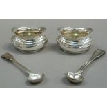 A George V pair of silver salts in George III style, boat shaped, 6cm wide, by EJH, Birmingham 1913;