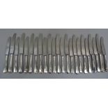 A set of twelve Harrods silver handled dessert knives and eleven matching dinner knives, Sheffield