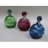 A set of three shaped circular scent flasks by Allister Malcolm, amethyst, blue and green with