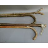 A walking stick with antler handle; together with three other walking sticks (4)