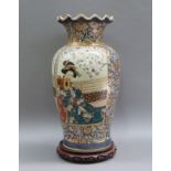 A 20th century Oriental vase with fluted rim and on hardwood stand, measuring overall 50cm
