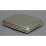 A George V silver cigarette case engine turned of square outline with rounded corners and open