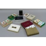 A collection of vintage and later playing cards including leather cased patience set, congress