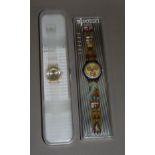 Two Swatch watches both boxed