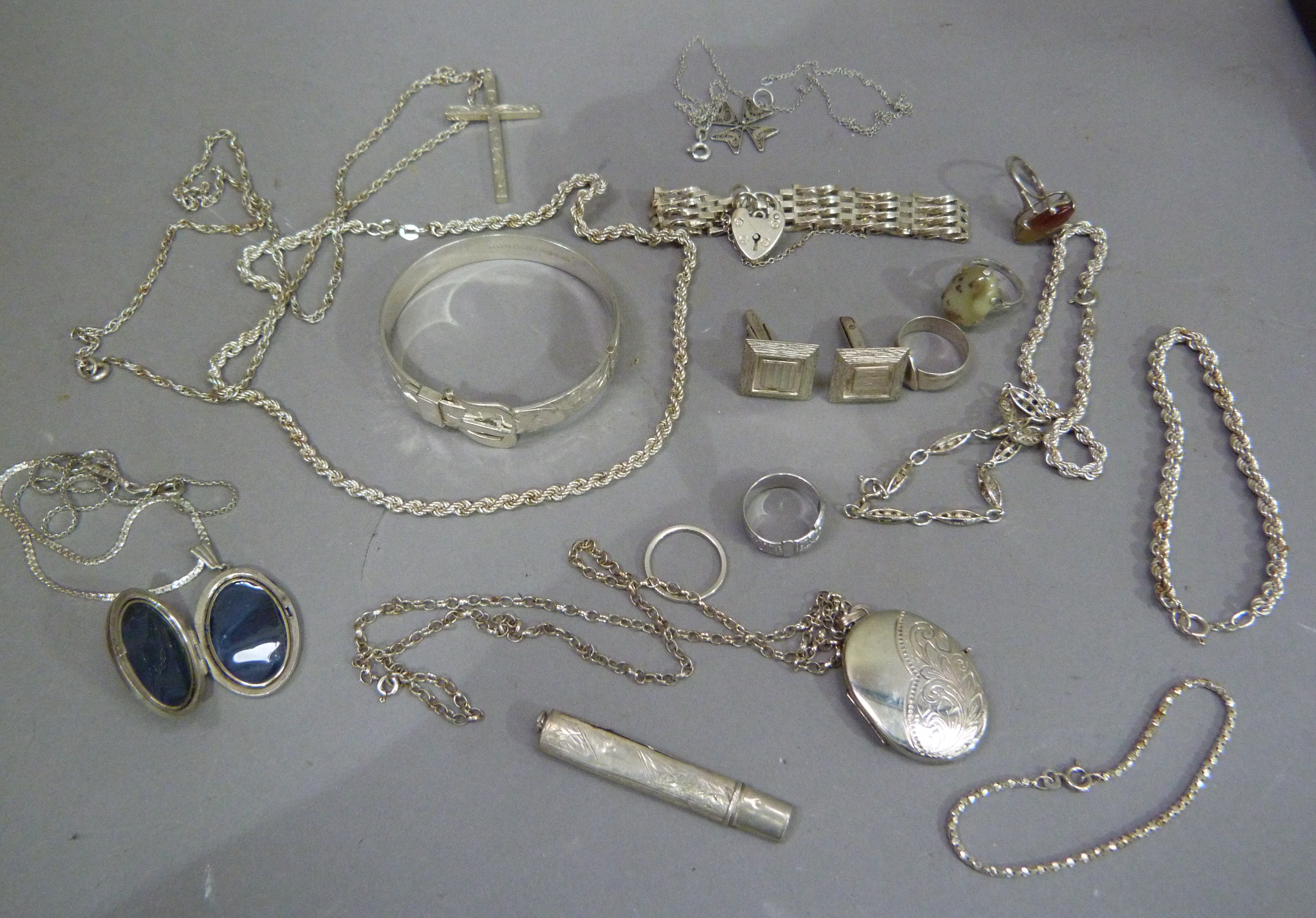 A collection of late 19th century silver jewellery including stiff hinged bangle, cross and chain,