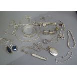 A collection of late 19th century silver jewellery including stiff hinged bangle, cross and chain,