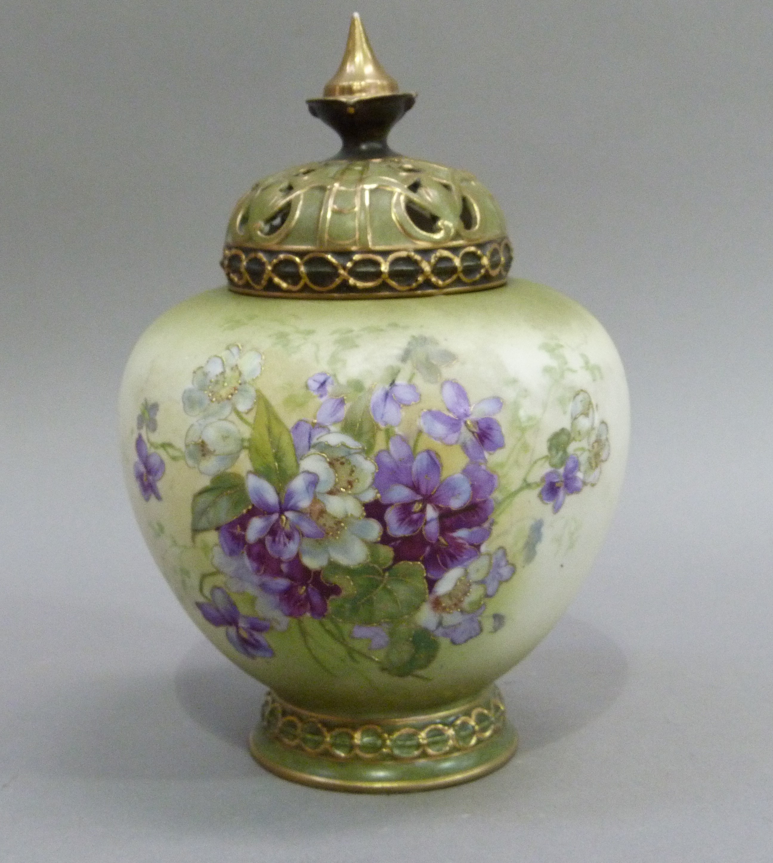 A Royal Vienna pot pourri vase and cover, the shaded green ground printed and enamelled with