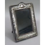 A Edward VII silver photograph frame on blue velvet mount, embossed with border of bell flowers,