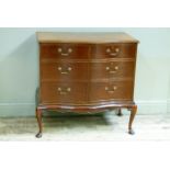 A mahogany cabinet in George III style the serpentine front enclosed by a pair of faux drawers