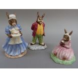 A Royal Doulton Bunnykins figure of mother with gilt signature to base together with father and