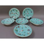 A set of four English pottery pedestal tazzas colourfully printed and painted with butterflies,