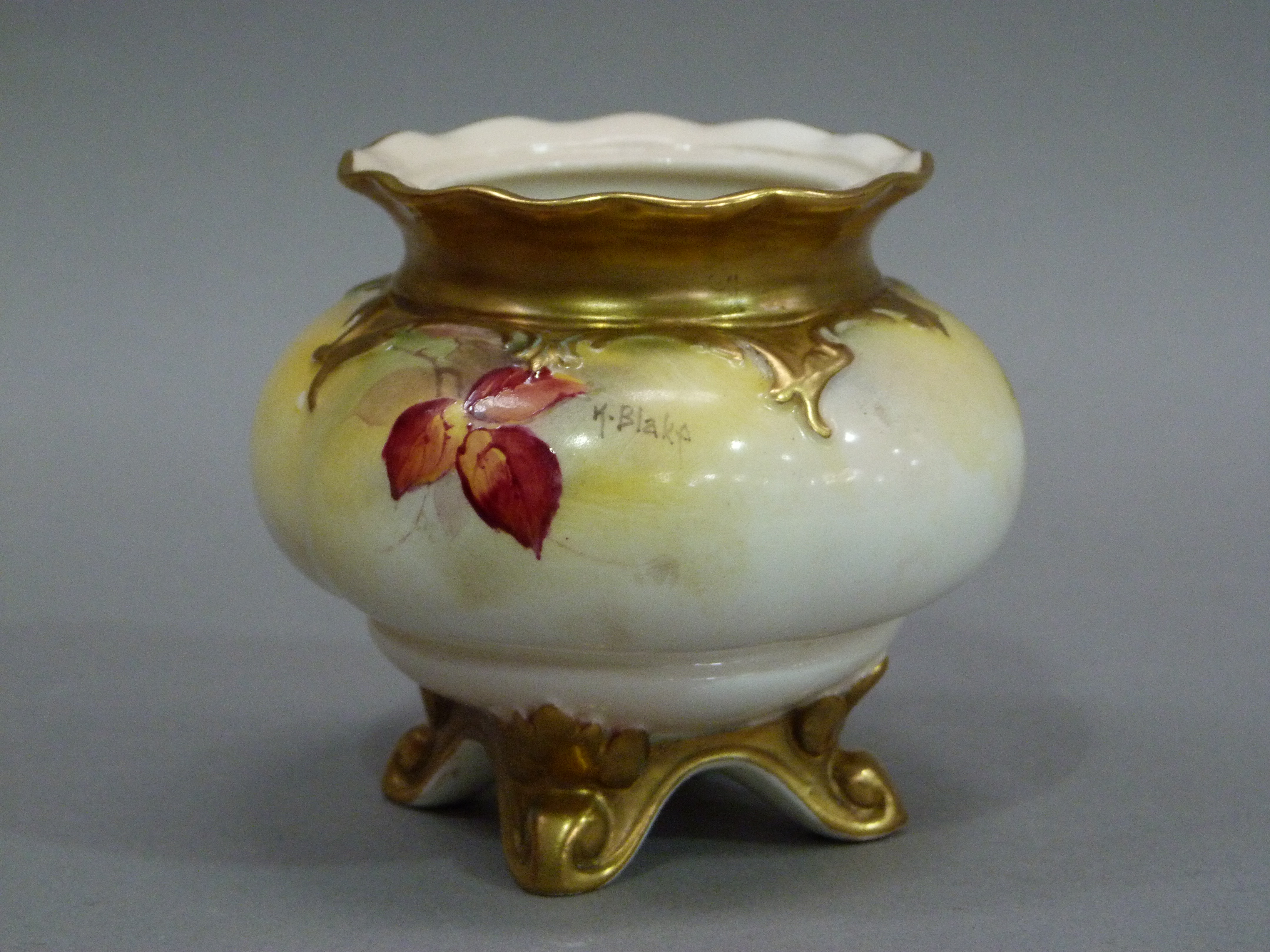 A Royal Worcester compressed globular fluted vase decorated with brambles, leafage and blossom on