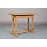 AN ARTS AND CRAFTS OAK OCCASIONAL TABLE, rectangular, plain apron and on writhen turned and square