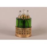 A SET OF THREE GREEN GLASS SCENT BOTTLES of segmental form, brass collars and spherical cut clear