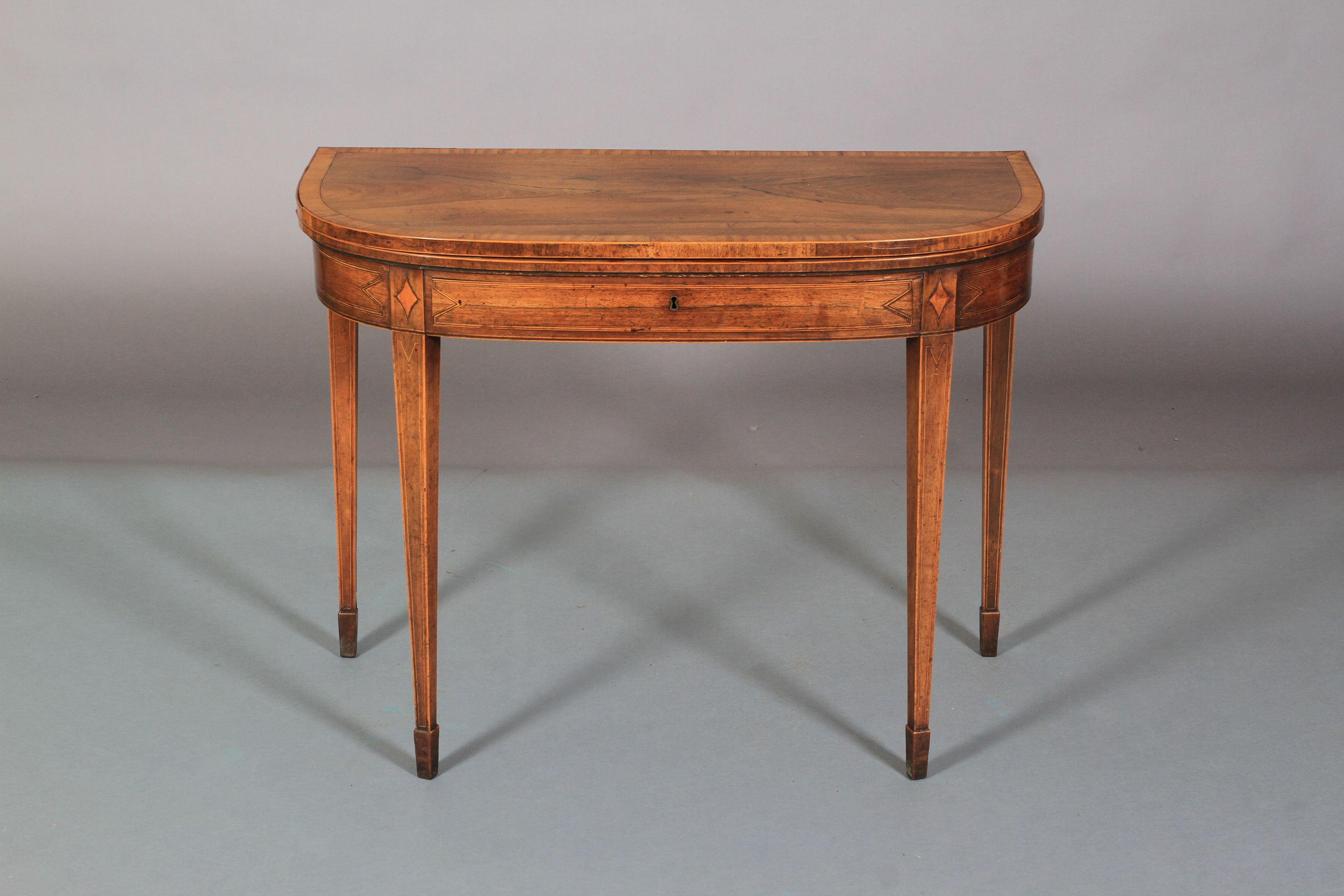 A GEORGE III ROSEWOOD AND SATINWOOD BANDED FOLD-OVER TEA TABLE of 'D' outline, line inlaid with - Image 2 of 6