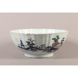 AN 18TH CENTURY CHINESE PORCELAIN FLUTED BOWL, circular, the exterior painted in underglaze blue,