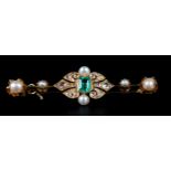 A 19TH CENTURY EMERALD, DIAMOND AND PEARL BOW, the pierced quatrefoil collet set to the centre