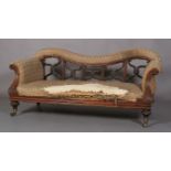 AN EARLY VICTORIAN ROSEWOOD SHOW FRAME SOFA, with upholstered top rail above moulded x-frame