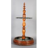 A 19TH CENTURY COUNTRY HOUSE FRUITWOOD AND CAST IRON UMBRELLA/STICK STAND, the turned post with