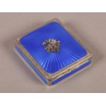 A .935 STANDARD CONTINENTAL SILVER AND ENAMEL BOX OR COMPACT, the hinged lid with bright blue