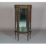 A FRENCH MAHOGANY AND GILT METAL MOUNTED VITRINE, of triple bowed outline, having a gilt metal