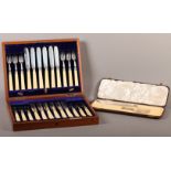 A SET OF TWELVE SILVER FISH KNIVES AND FORKS with engraved border and ivory handles, Sheffield 1906,
