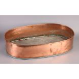 AN EARLY 20TH CENTURY COPPER TROUGH of oval outline, 60.5cm x 38cm x 13cm high