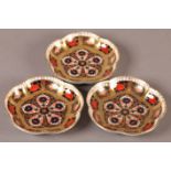 A SET OF THREE ROYAL CROWN DERBY pin dishes of circular scalloped outline, Japan palette no.1128,