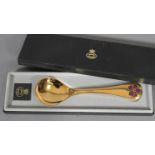 GEORG JENSEN, a .925 silver gilt year spoon for 1974 with corn cockle motif in aubergine and green