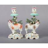 A PAIR OF SAMSON PARIS PORCELAIN TABLE CANDLESTICKS modelled with sheep standing before floral