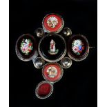 A 19TH CENTURY BROOCH collet set in silver gilt with six micro-mosaic images each set in red or