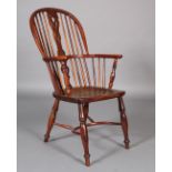 A MID 19TH CENTURY YEW WOOD HIGH BACK WINDSOR ARMCHAIR, with pierced vase shaped splat, saddled seat