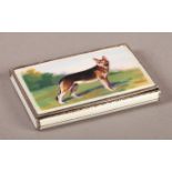 A CONTINENTAL SILVER AND ENAMEL BOX, the hinged lid decorated with an Alsatian dog in an extensive