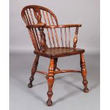 A MID 19TH CENTURY ASH AND ELM LOW BACK WINDSOR ARMCHAIR with pierced vase shaped splat saddled