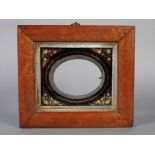 AN EARLY VICTORIAN PICTURE FRAME with birds eye maple cushion frame with reverse painted glass,