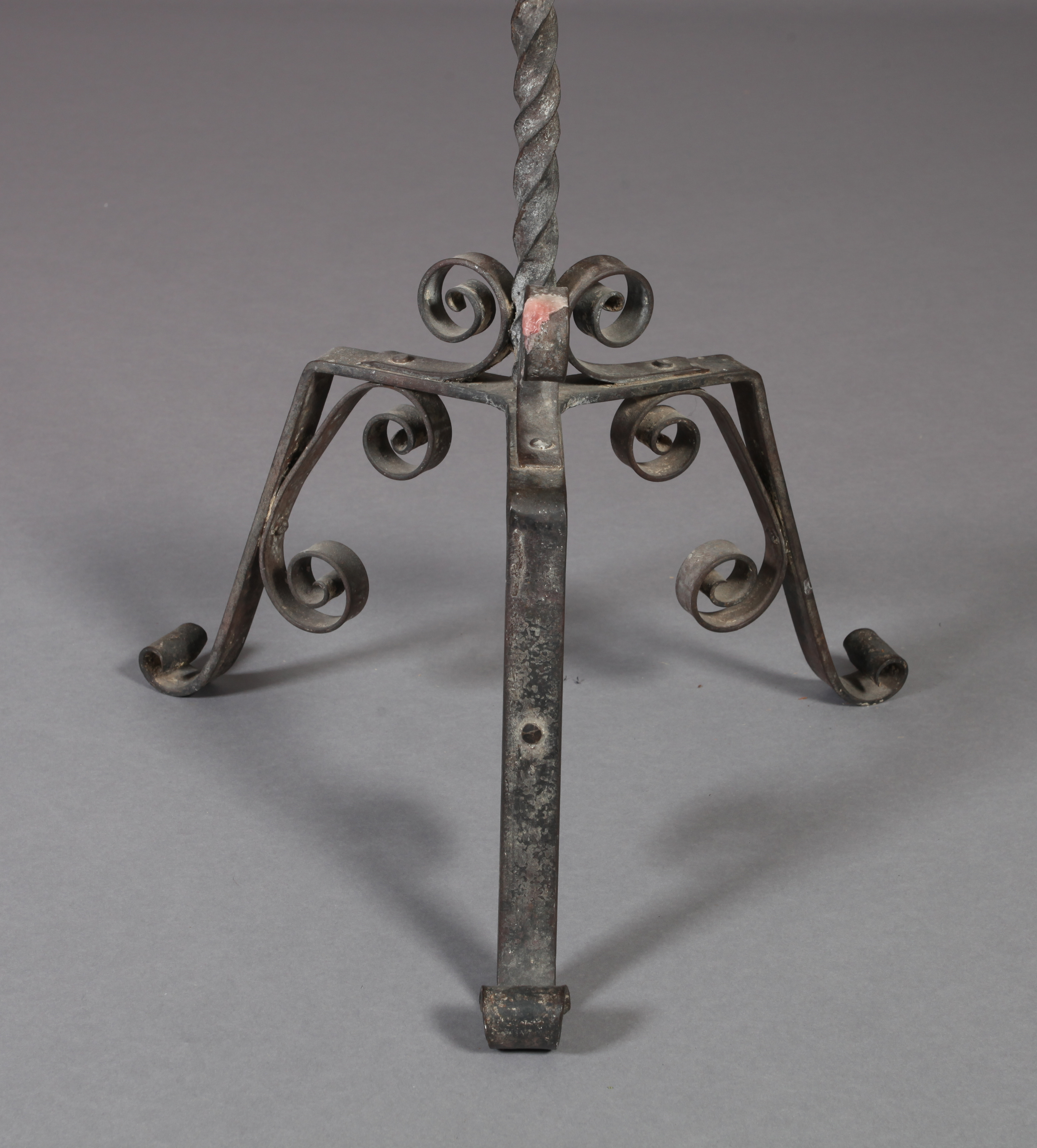 AN ARTS AND CRAFTS WROUGHT IRON CANDLESTAND with broad frilled drip pan supported on four animal - Image 3 of 3