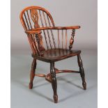 A 19TH CENTURY YEW WOOD LOW BACK WINDSOR ARMCHAIR having a pierced splat and rail back, turned