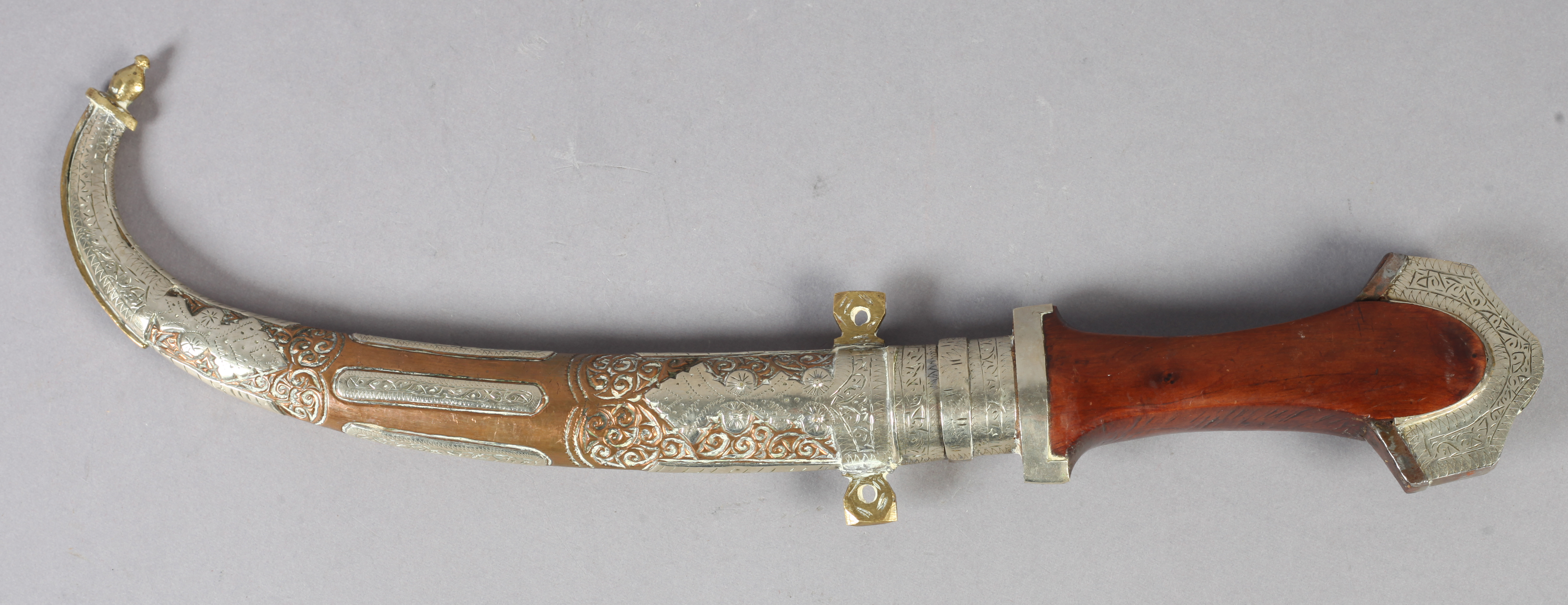 A MIDDLE EASTERN DAGGER (JAMBIYA) curved blade 21.5cm long, hardwood grip with chased white metal - Image 4 of 6