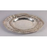 A SET OF THREE GRADUATED PLATED ON COPPER MEAT DISHES of oval outline with wavy gadroon rims, each