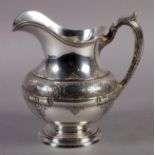 A STERLING SILVER EWER of baluster form, strapwork girdle chased with scrolling leafage centred with