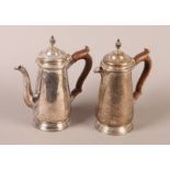 A PAIR OF GEORGE VI SILVER CAFE AU LAIT POTS, of 18th century design, having stained wood handles,