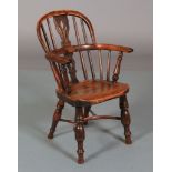 A CHILD'S 19TH CENTURY YEW WOOD WINDSOR ARMCHAIR, pierced splat and rail back, turned uprights and