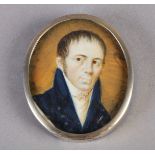 A 19TH CENTURY PORTRAIT MINIATURE of a gentleman, head and shoulders, dark hair and eyes, wearing