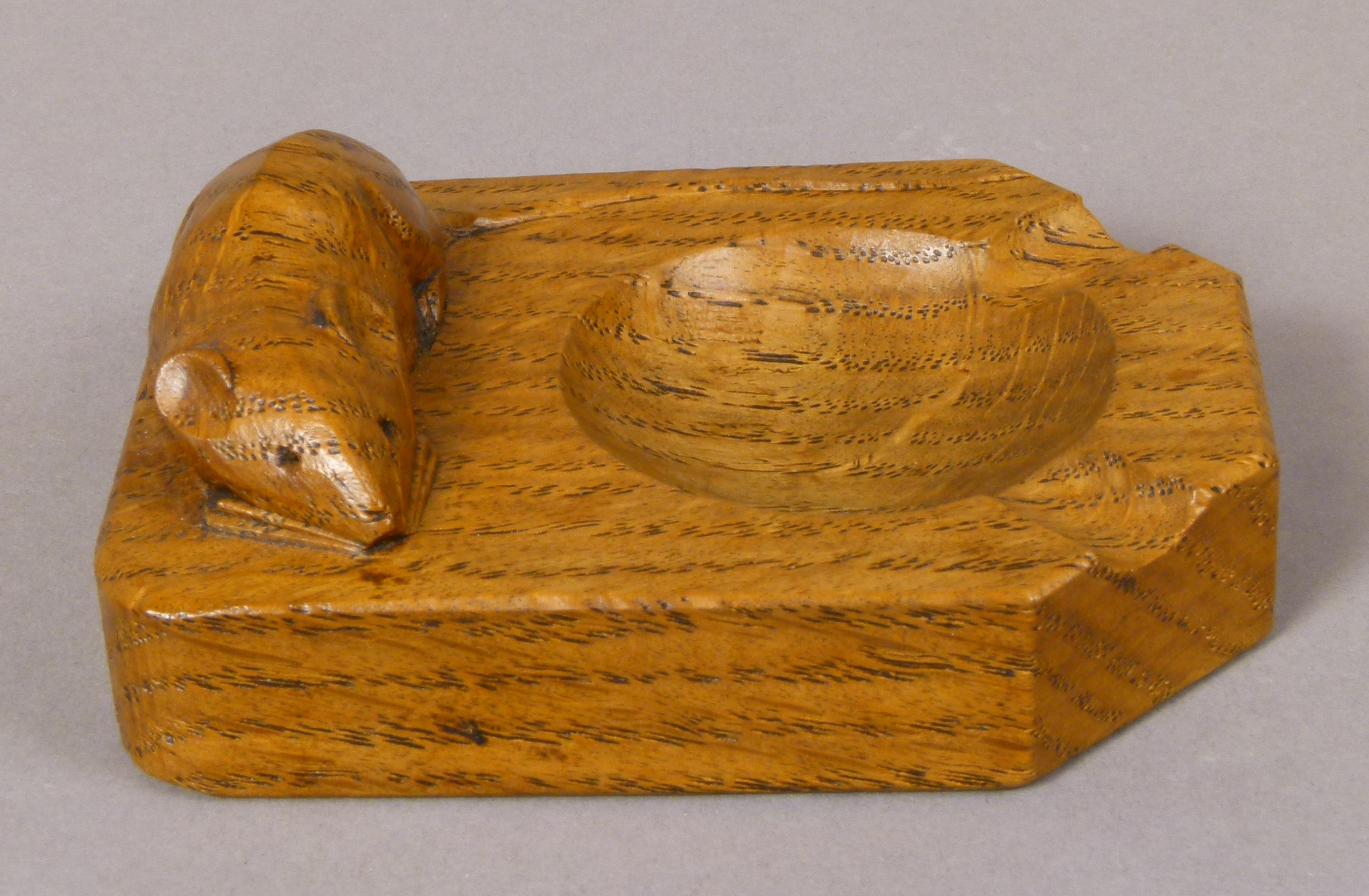 A THOMPSON OF KILBURN 'MOUSEMAN' ENGLISH OAK ASHTRAY, rectangular carved in relief with a mouse,