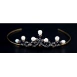 A DIAMOND AND FRESHWATER CULTURED PEARL TIARA, the seven approximate 7.5mm pearls set within rose