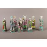 A COLLECTION OF EIGHT CHINESE FAMILLE ROSE IMMORTALS, Qianlong (1736-1795), standing, each holding