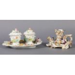 A COALPORT PORCELAIN FLORAL ENCRUSTED DESK STAND having two inkwells with domed covers and leaf