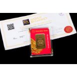 A 50GM INGOT OF 999.9 FINE GOLD, minted by Emirates Gold, in sealed plastic case with supporting