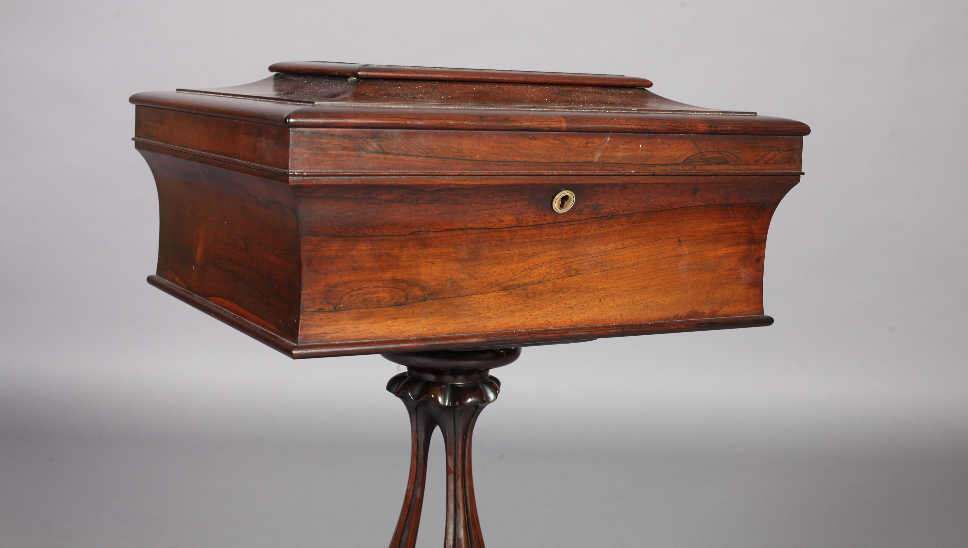 A VICTORIAN ROSEWOOD VENEERED TEAPOY, the shallow sarcophagus shaped top hinged to reveal an - Image 4 of 4