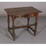 A MID 17TH CENTURY OAK SIDE TABLE, the planked top with cleated ends, twin indented panel drawer